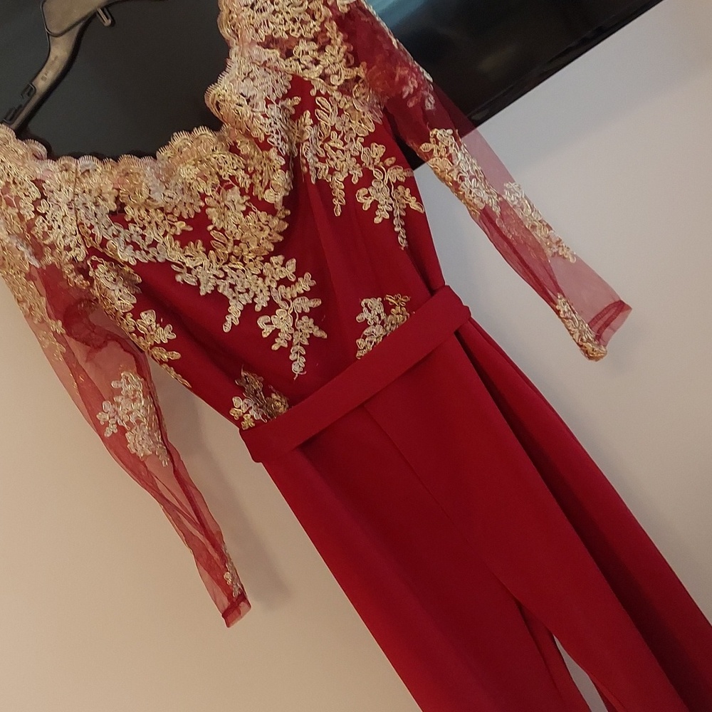 Size large, bell bottom pant suit with gold appliques on bodice and 3/4 sleeves